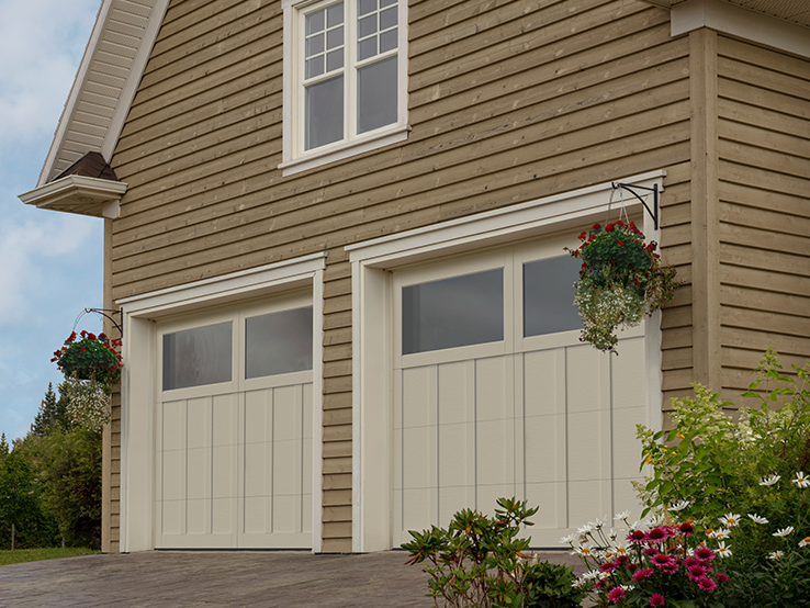 Garaga residential garage door in Desert Sand with the P-13 design, matching overlays and Panoramic windows.