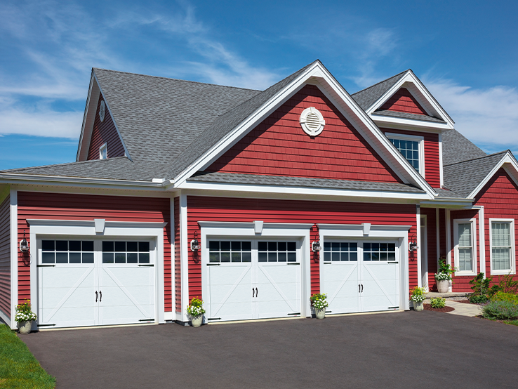 Garaga residential garage door in Ice White with the P-22 design, matching overlays and Panoramic windows.