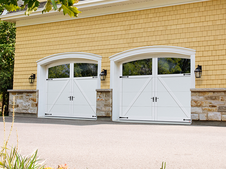 Garaga residential garage door in Ice White with the P-22 design, matching overlays and Arch Overlay.