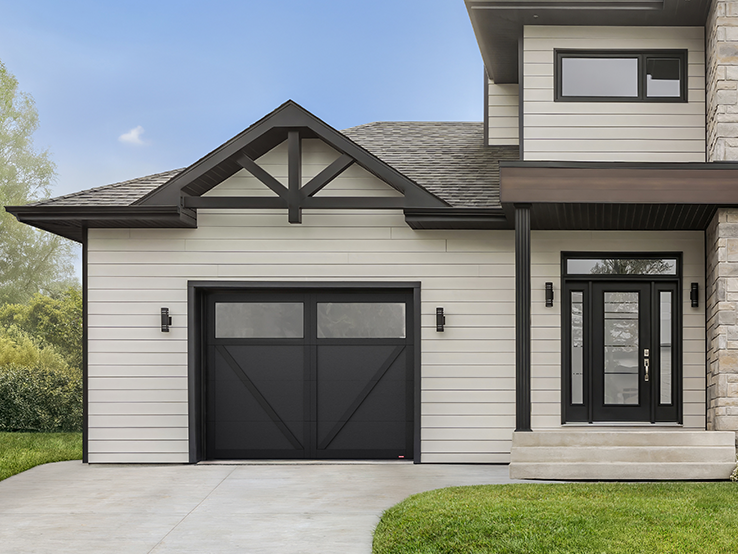 Garaga residential garage door in Black with the P-23 design, matching overlays and Panoramic windows.