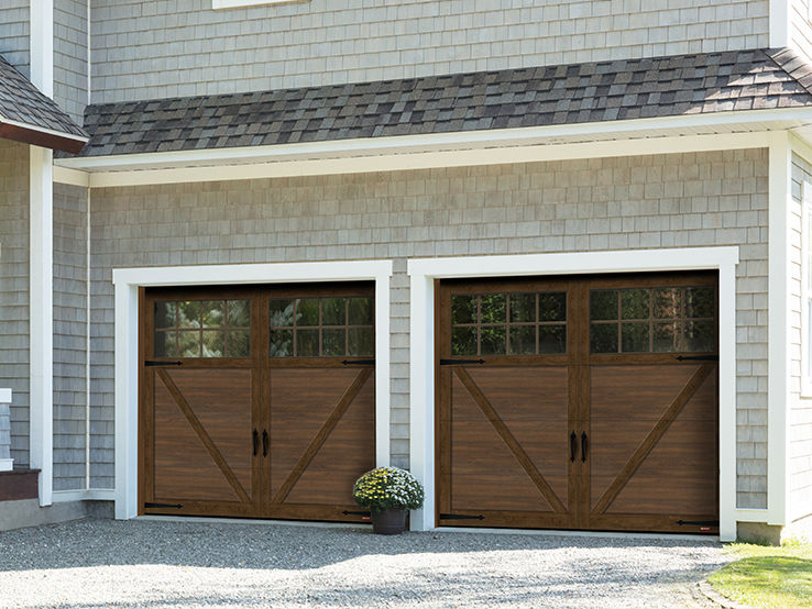 Garaga residential garage door with a Chocolate Walnut faux-wood finish, the P-23 design, matching overlays and Panoramic windows.