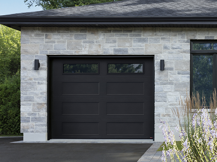 Garaga residential garage door in Black with the Shaker-Flat XL design and windows.