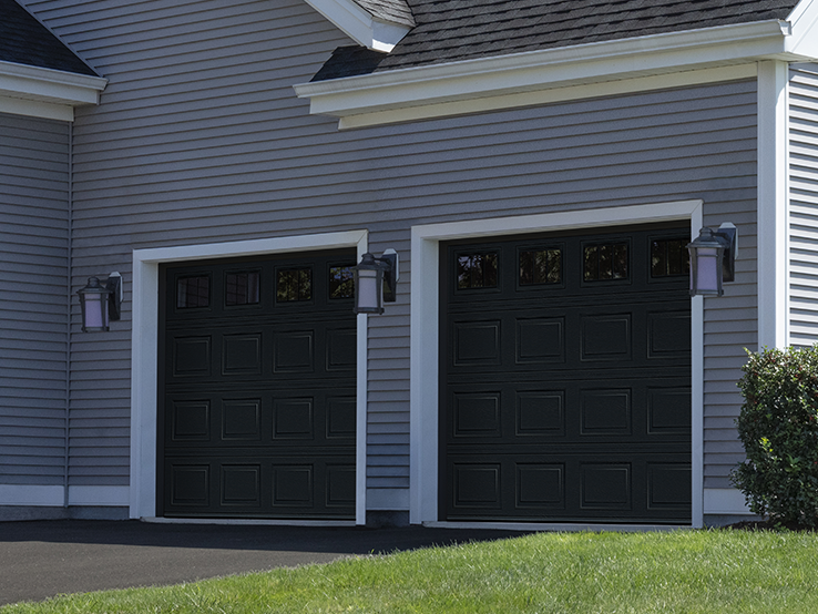 Garaga residential garage door in Black Ice with the Short Panel design and Richmond window inserts.
