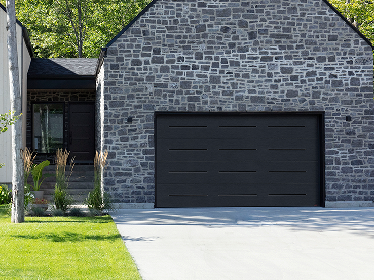 Garaga residential garage door in Black with the Vogue design.