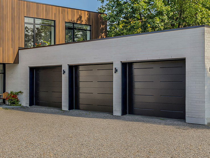 Garaga residential garage door in Black with the Vogue design.