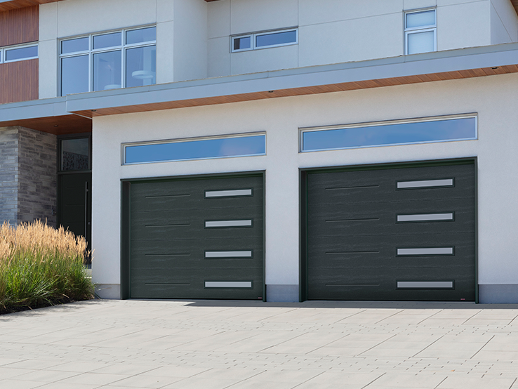 Garaga residential garage door in Iron Ore with the Vogue design and Right-side Harmony windows.