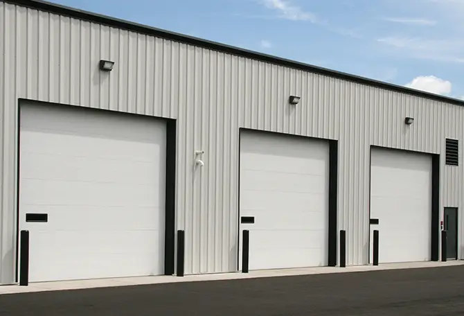 Three EPS 3026HD commercial garage doors on a commercial building