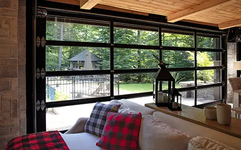 Interior view of a finished garage with full-glass California garage doors