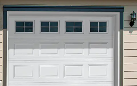 Close up of a white garade door with Orion windows