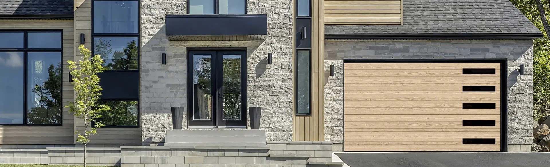Modern home with a Garaga Natural Oak HD wood tone contemporary garage door featuring clean horizontal grooves.