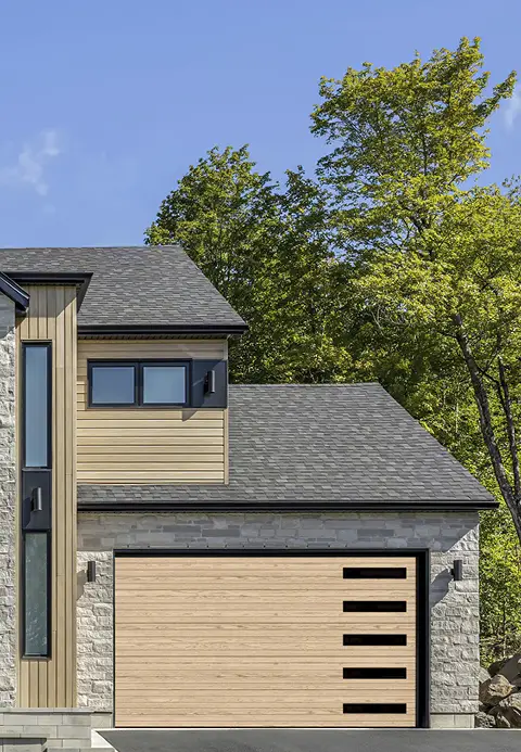 Modern home with a Garaga Natural Oak HD wood tone contemporary garage door featuring clean horizontal grooves.